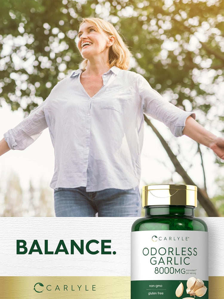 Middle-aged woman smiling with arms outstretched outdoors next to an Odorless Garlic bottle.