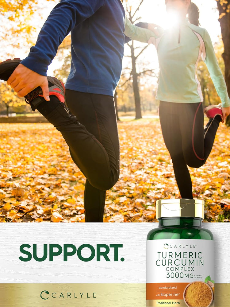 Two adults stretch in autumn next to a Carlyle Turmeric Curcumin bottle, highlighting its use for joint support.