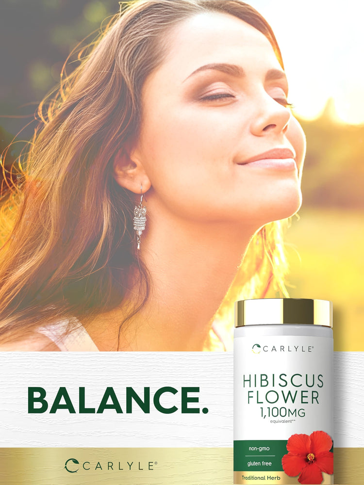 A young woman enjoys the sunshine while sitting next to a Carlyle Hibiscus Flower supplement.
