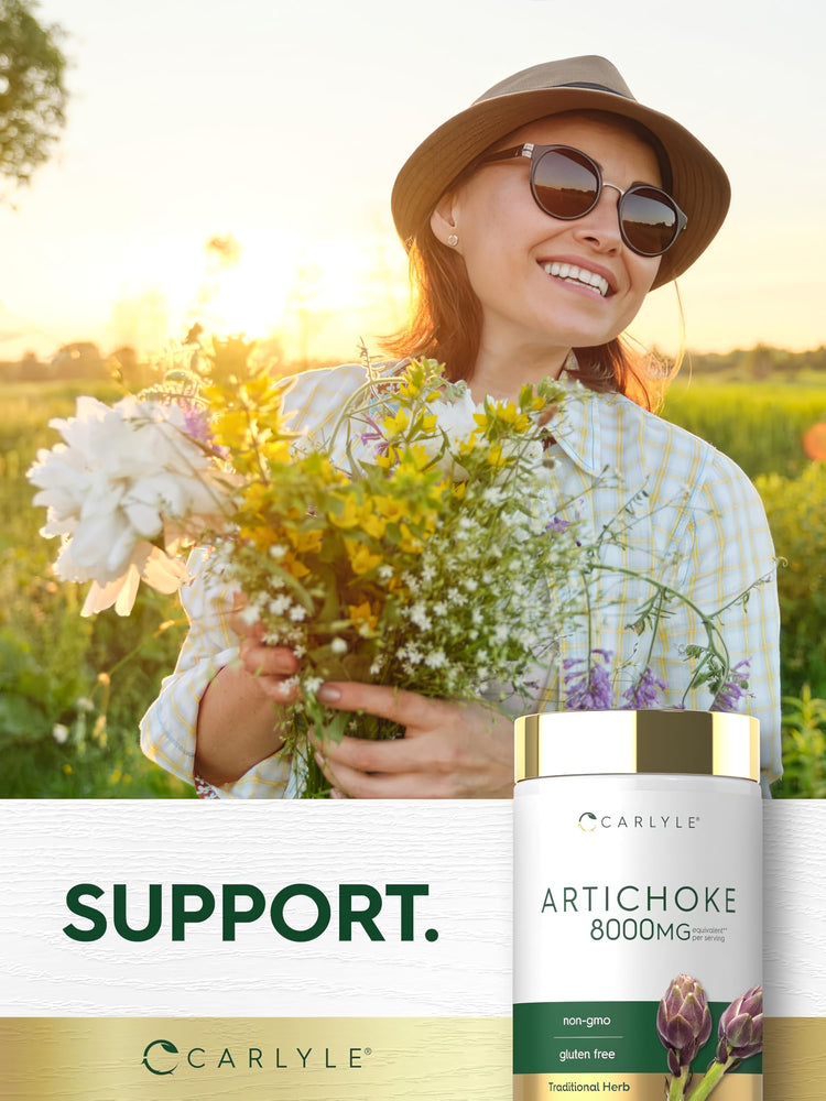 Woman smiling with a bouquet of wildflowers in a sunny field, next to a bottle of Artichoke 8000 mg.