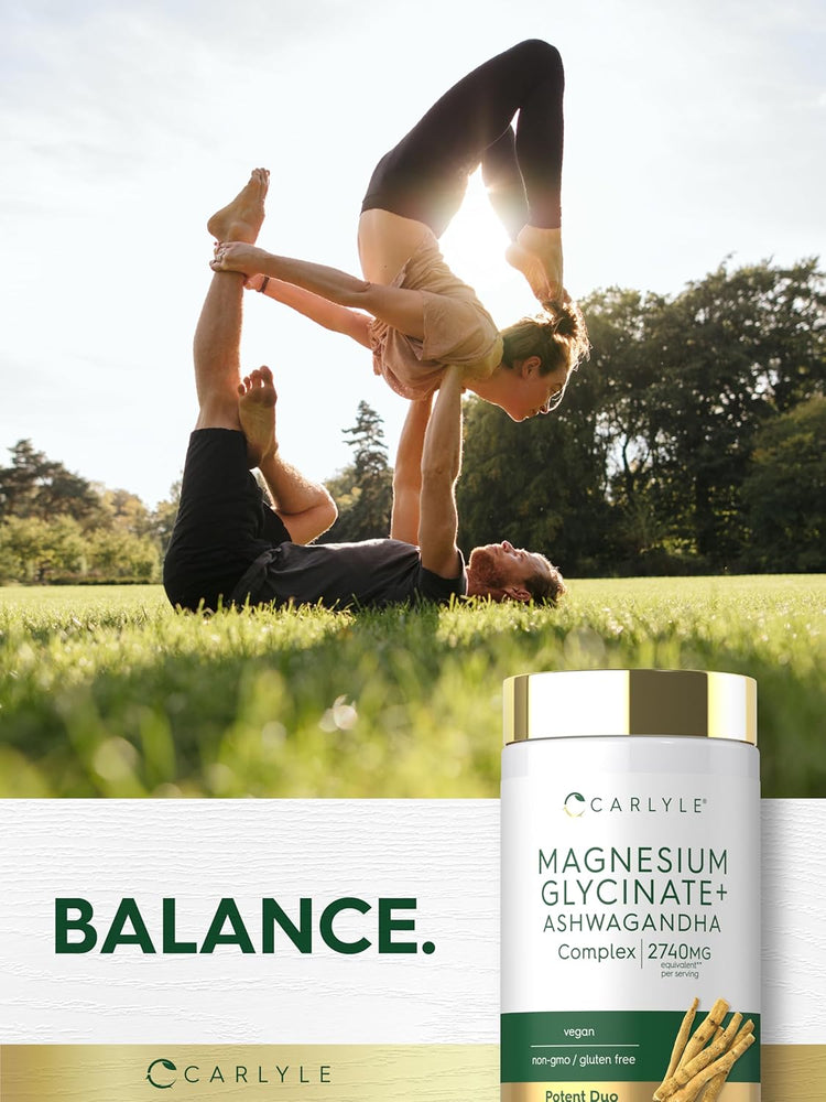 Two adults perform acro yoga in a sunny park with a Carlyle Magnesium Glycinate + Ashwagandha bottle in the foreground.