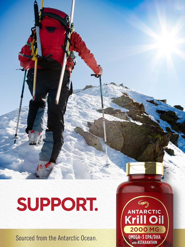 Person hiking a snowy mountain trail while carrying a bottle of Antarctic Krill Oil.