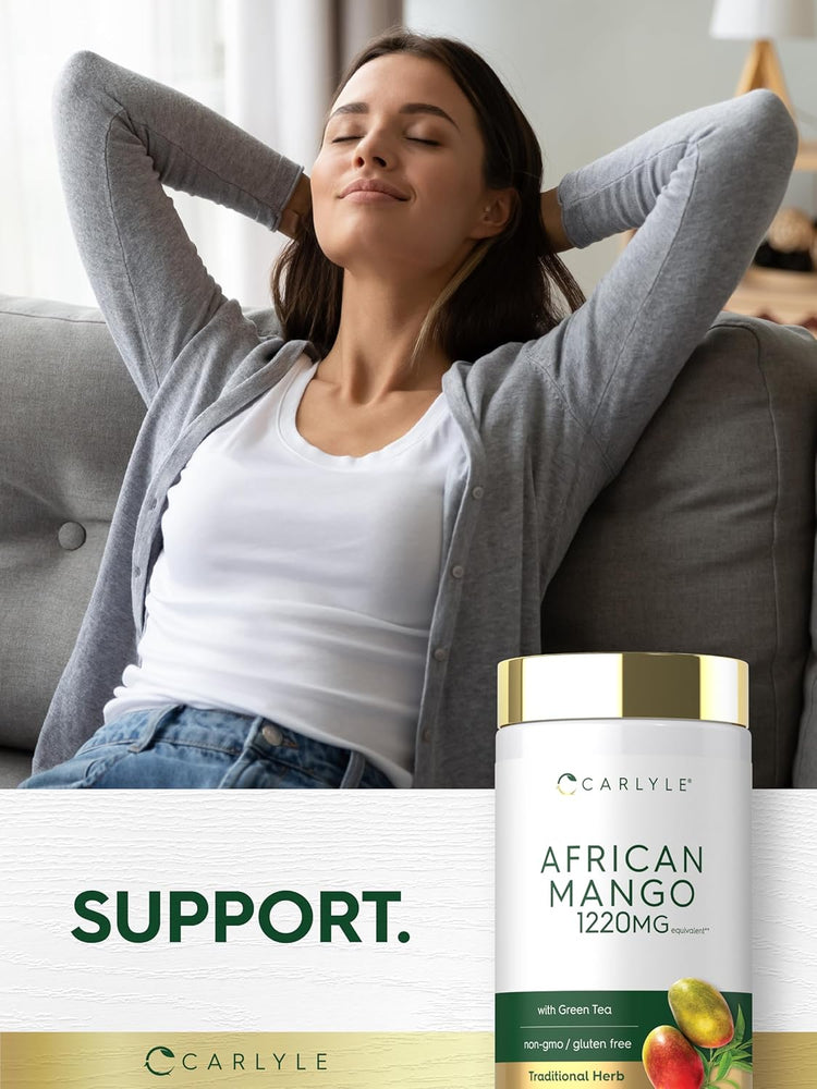 A young adult female relaxes on a sofa with an African Mango bottle beside her.