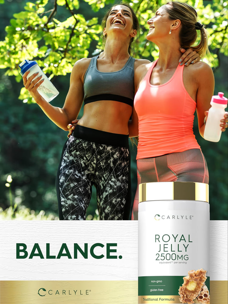 Two young women laugh and relax outdoors after exercise, with a Royal Jelly bottle beside them.