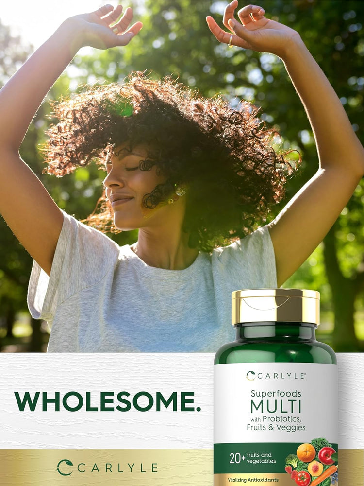 A young adult woman smiles with arms raised outdoors beside a Carlyle Superfoods Multi bottle.