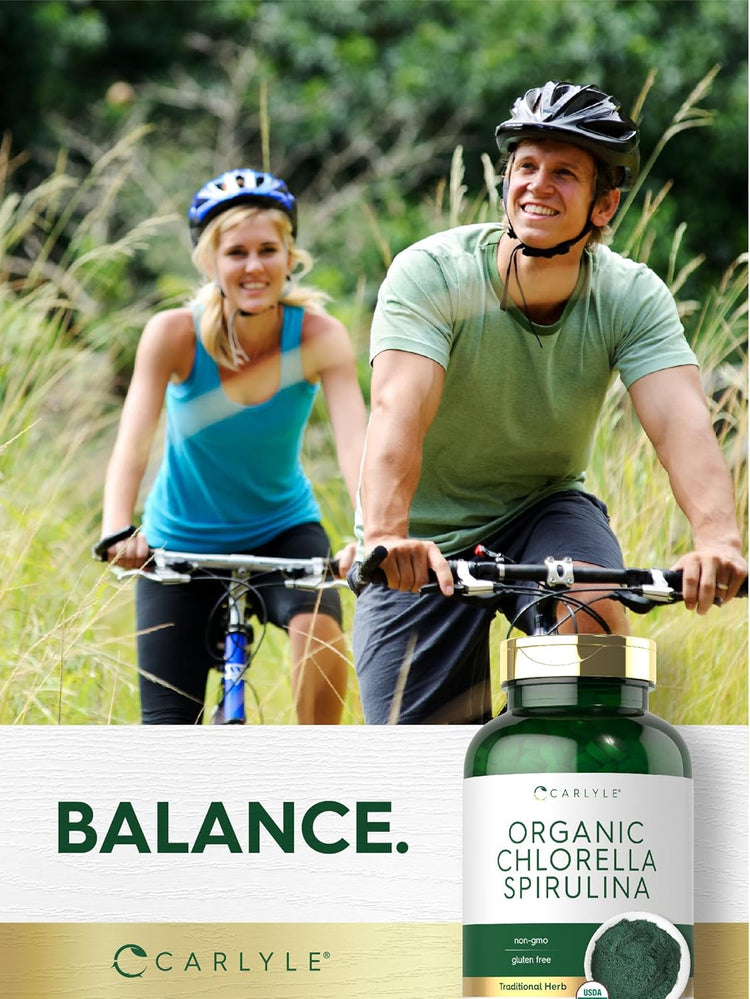 A young man and woman biking outdoors while showcasing a bottle of Organic Chlorella Spirulina.