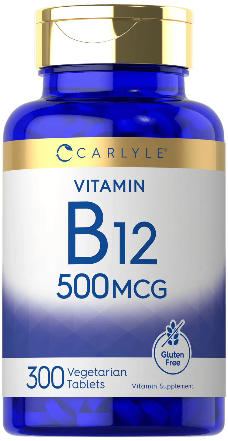 Hand holding Carlyle Vitamin B-12 500 MCG 300 Vegetarian Tablets bottle on a scale.