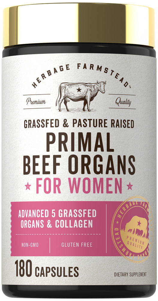 Hand holding a bottle of Primal Beef Organs supplements, 180 capsules, designed for women. Focus on health and wellness benefits.