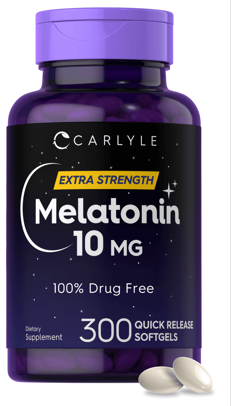 Two off-white 10 MG quick release softgels displayed on a hand scale in bulk for measurement or comparison.