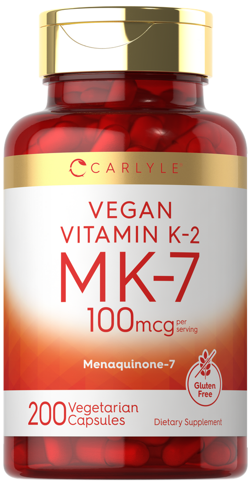 Carlyle Vegan Vitamin K-2 MK-7 100mcg with 200 vegetarian capsules displayed on a hand scale.