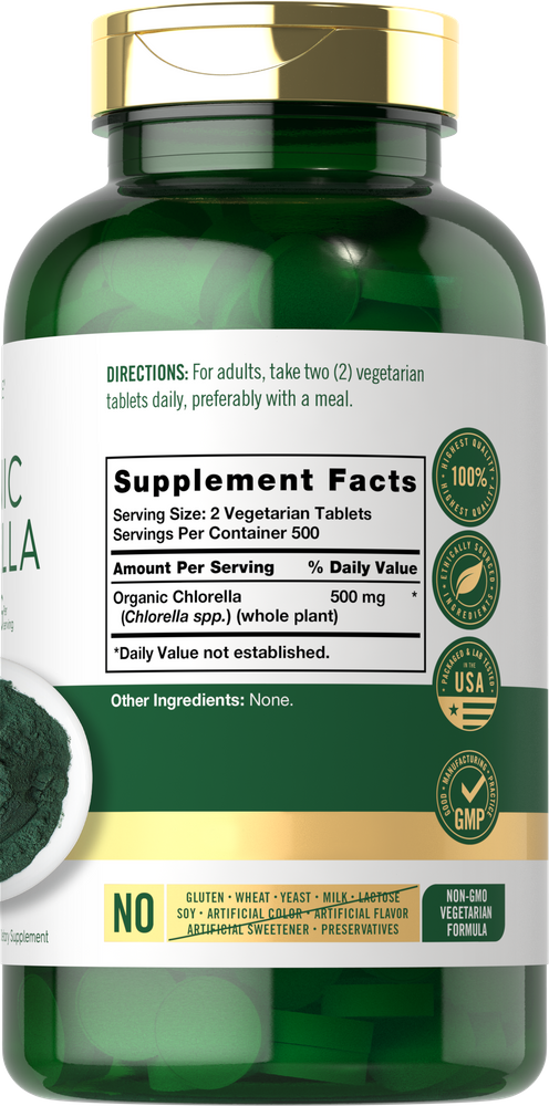 A hand holds a bottle of 1000 vegetarian tablets, each containing 500 mg of organic Chlorella, depicting supplement size.