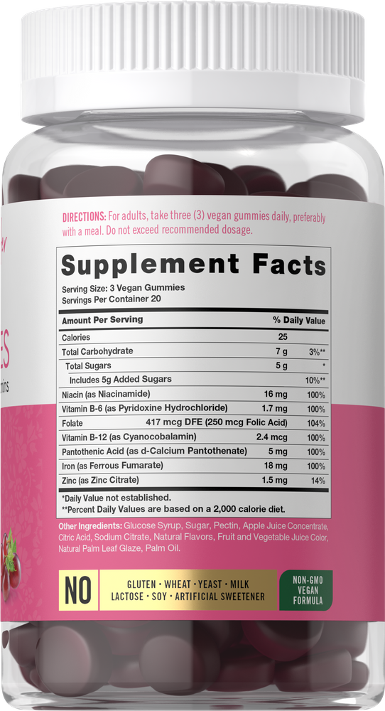 Carlyle Iron Gummies bottle with 60 heart-shaped, dark red gummies shown on hand scale.
