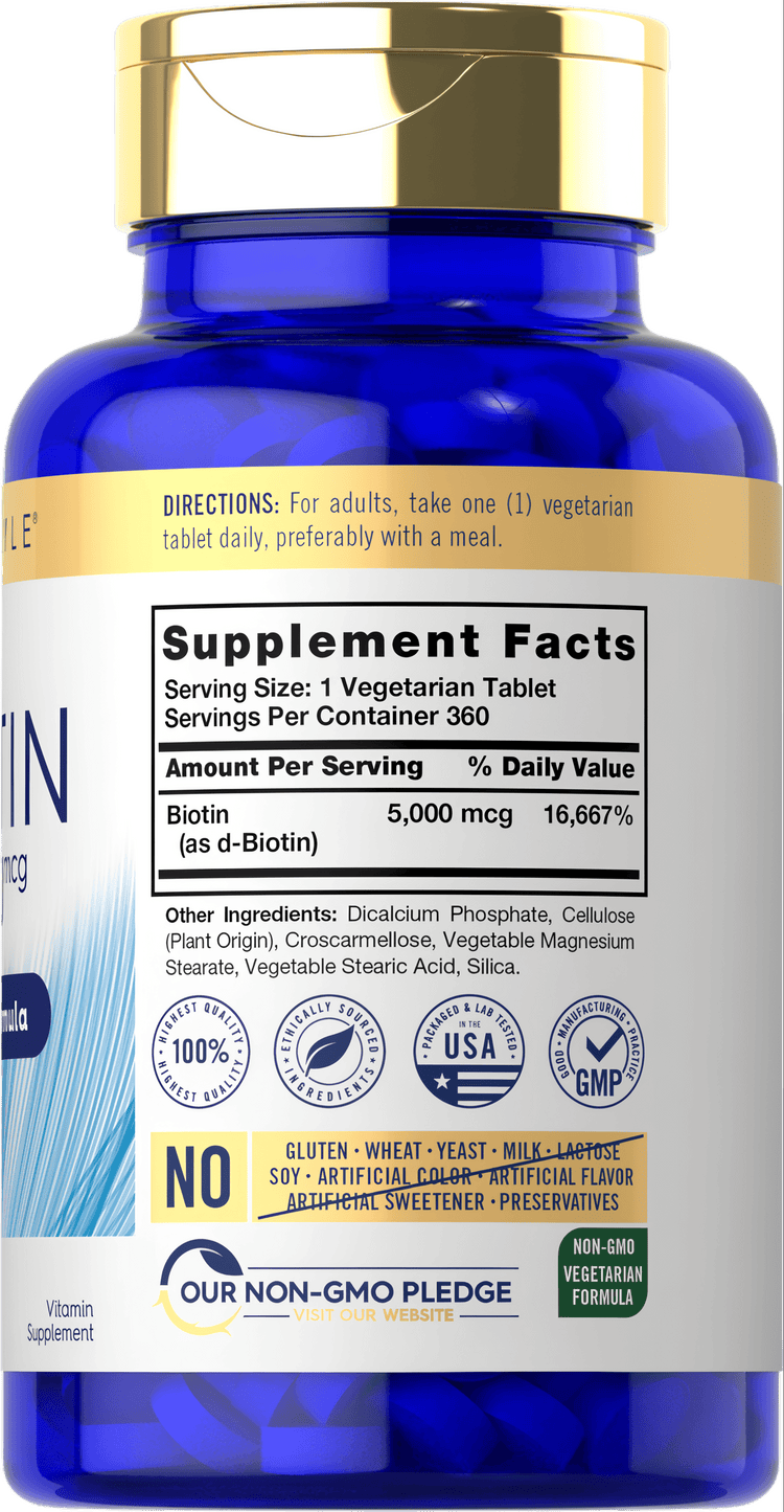 Carlyle Biotin 5000 mcg vegetarian tablets on hand, illustrating product size and packaging.
