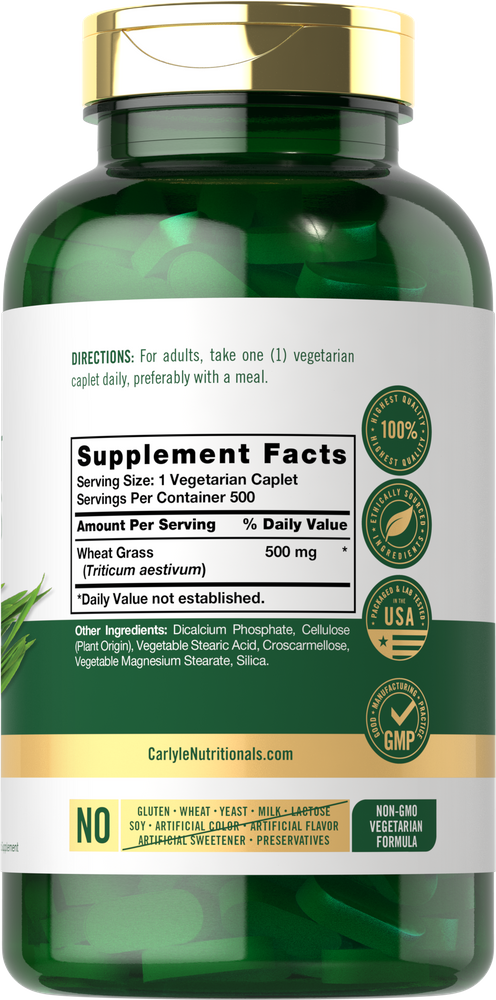 A hand holds a Wheat Grass Vegetarian Caplet, 500 mg, on a scale showcasing its precise weight for accurate dosage.