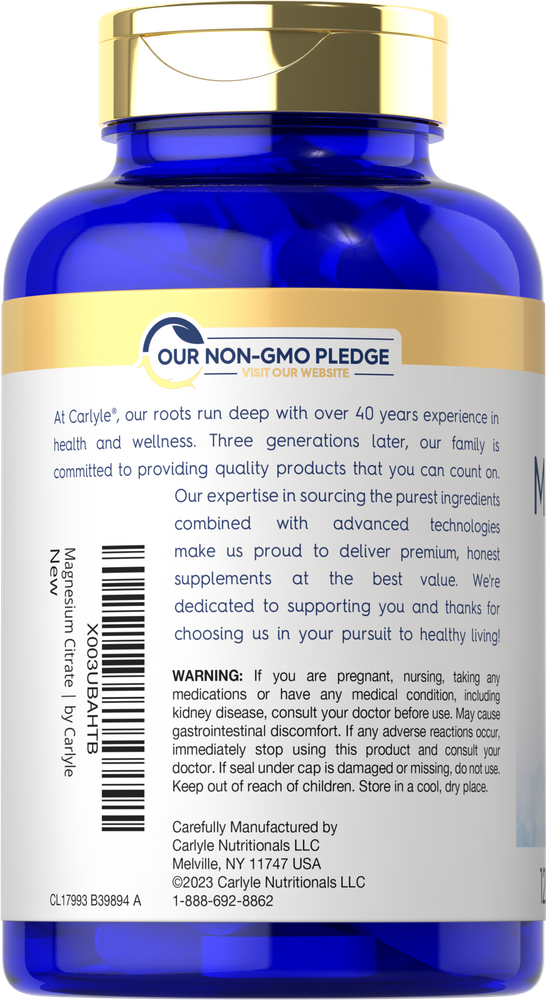 Hand holding a bottle of Carlyle Magnesium Citrate 1800 mg tablets, suitable for measuring with a hand scale.