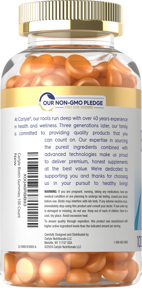 A clear jar with a gold cap containing 100 orange Carlyle Biotin Gummies.