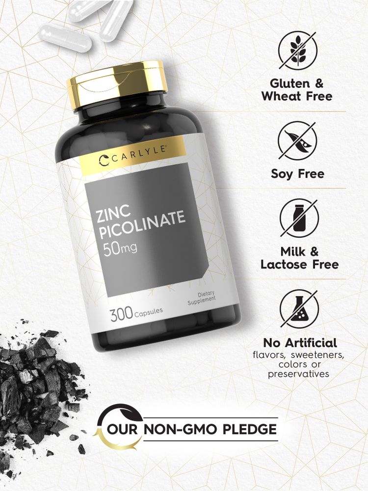White Zinc Picolinate 50 mg capsules next to a Carlyle bottle and black charcoal, indicating supplement context.