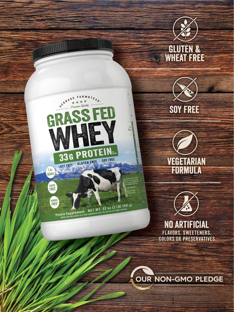 A 32 oz (2 LB) tub of Grass Fed Whey protein powder, weighing 907 g.