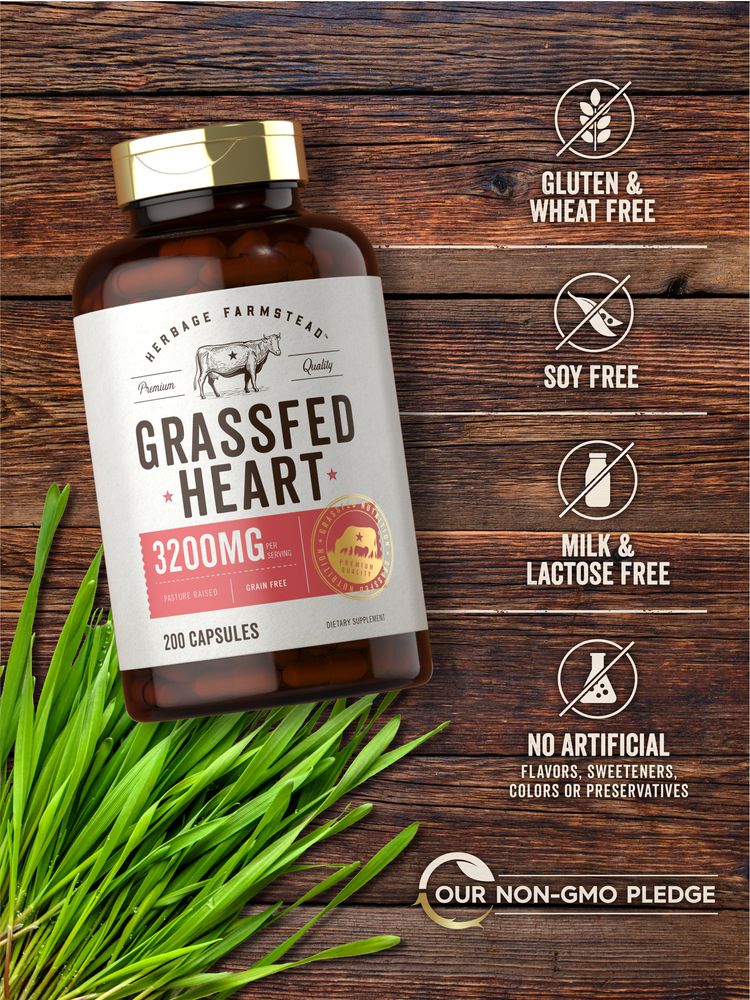 Hand holding bottle of Grassfed Heart supplement; 3200mg per serving, 200 capsules.