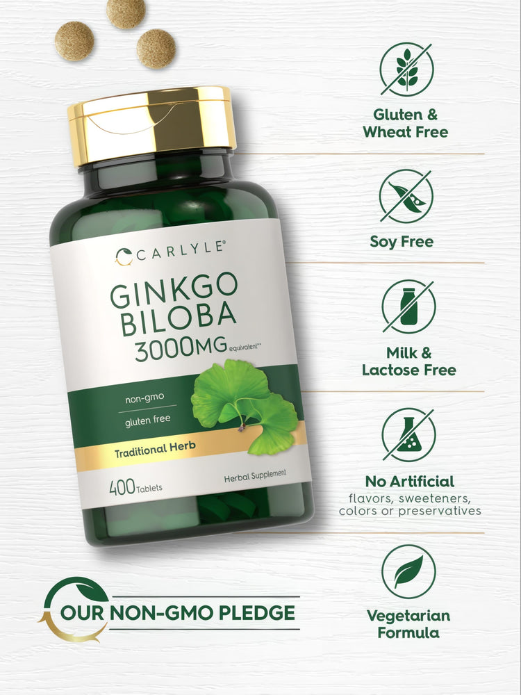 A hand holding three round, light brown Ginkgo Biloba tablets, each equivalent to 3000 mg.