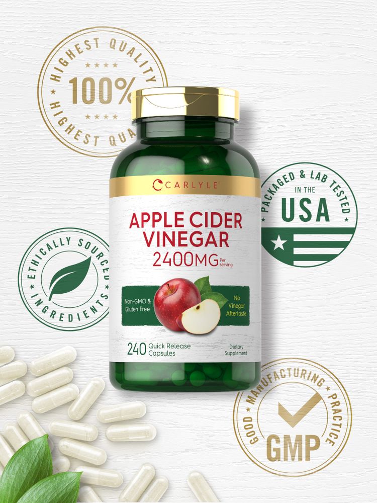 A hand holding a bottle of Apple Cider Vinegar 2400mg, containing 240 quick release capsules.