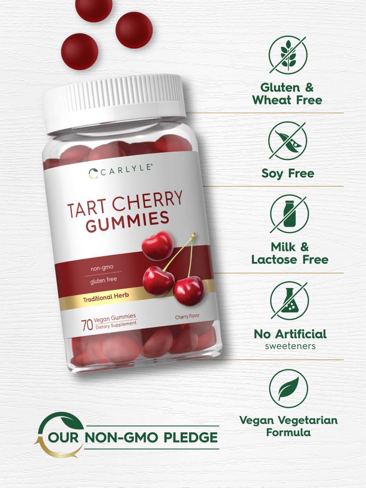 Carlyle Tart Cherry 70 Gummies in a clear jar, with scattered red gummies on a white wooden surface.
