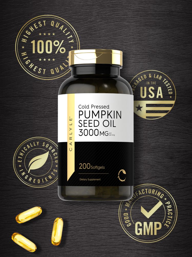 Three golden Pumpkin Seed Oil 3000 MG Softgels placed on a hand scale providing a visual indication of their size and quantity.