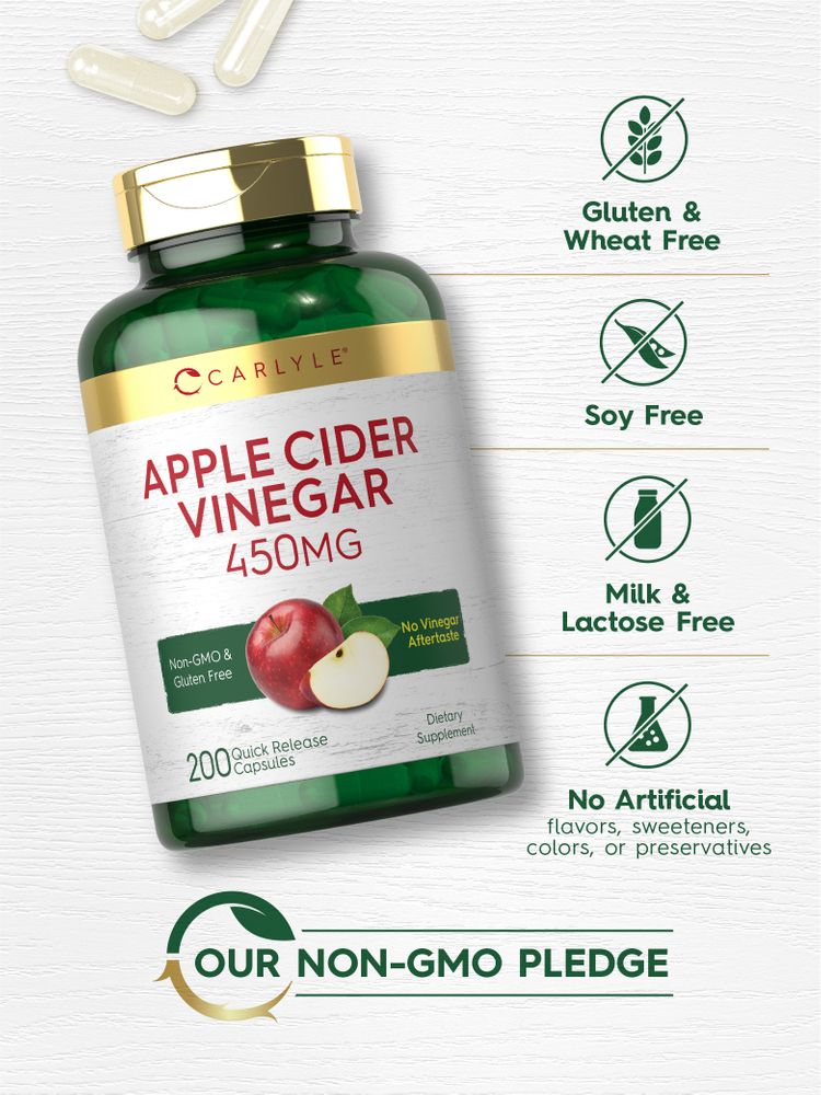 Hand holding Carlyle Apple Cider Vinegar 450 mg capsules, showcasing product size and scale for reference.