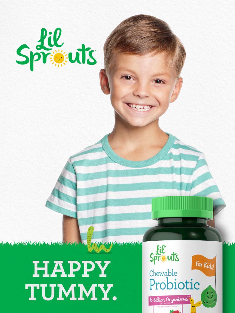 Young boy smiling while holding a bottle of Lil' Sprouts Chewable Probiotic.