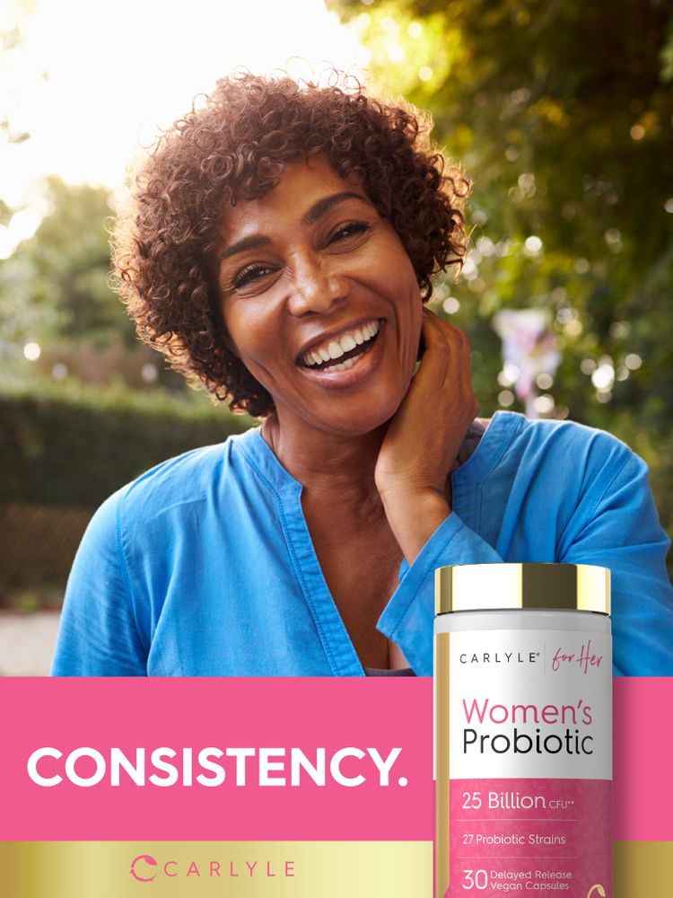 A smiling woman outdoors holds her neck, next to a Women's Probiotic bottle.
