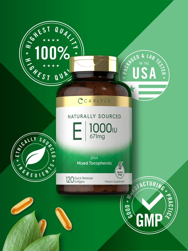 Three orange oval Quick Release Softgels lie alongside green leaves on the hand scale.