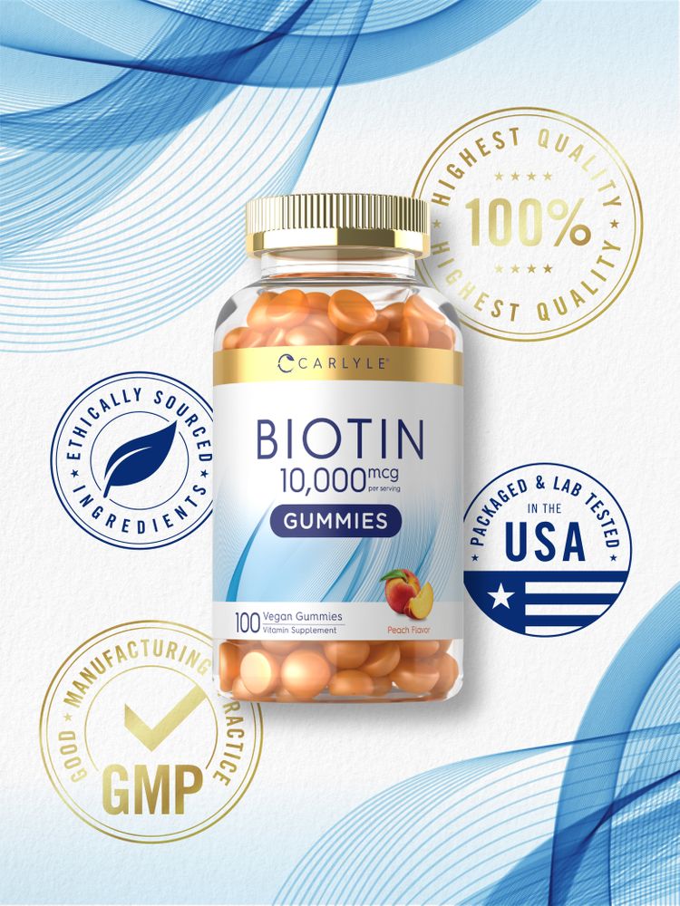 A hand holding Carlyle Biotin 10,000 mcg Vegan Gummies, 100 count, in peach flavor, showing the bulk of the bottle for scale.