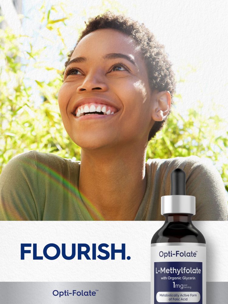 Young woman smiling outdoors with an L-Methylfolate liquid bottle.