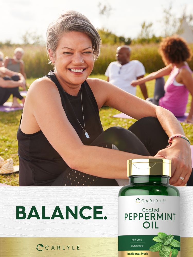 A bottle of Carlyle Coated Peppermint Oil containing 150 softgels, shown on a hand for scale, emphasizing its size.