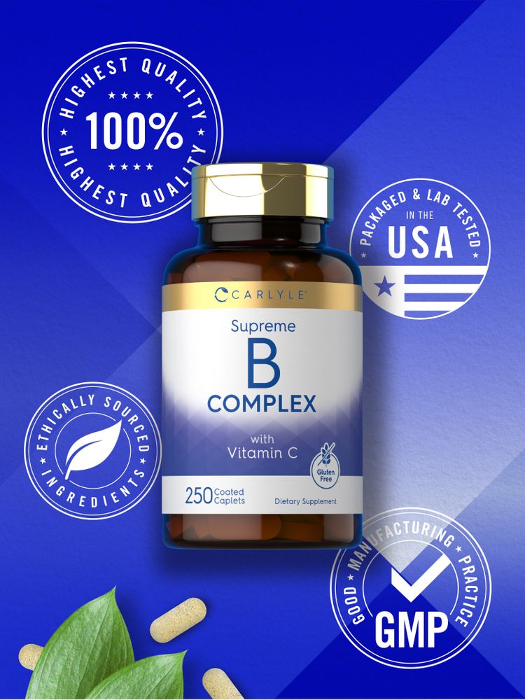 Carlyle Supreme B Complex with Vitamin C coated caplets displayed with green leaves.
