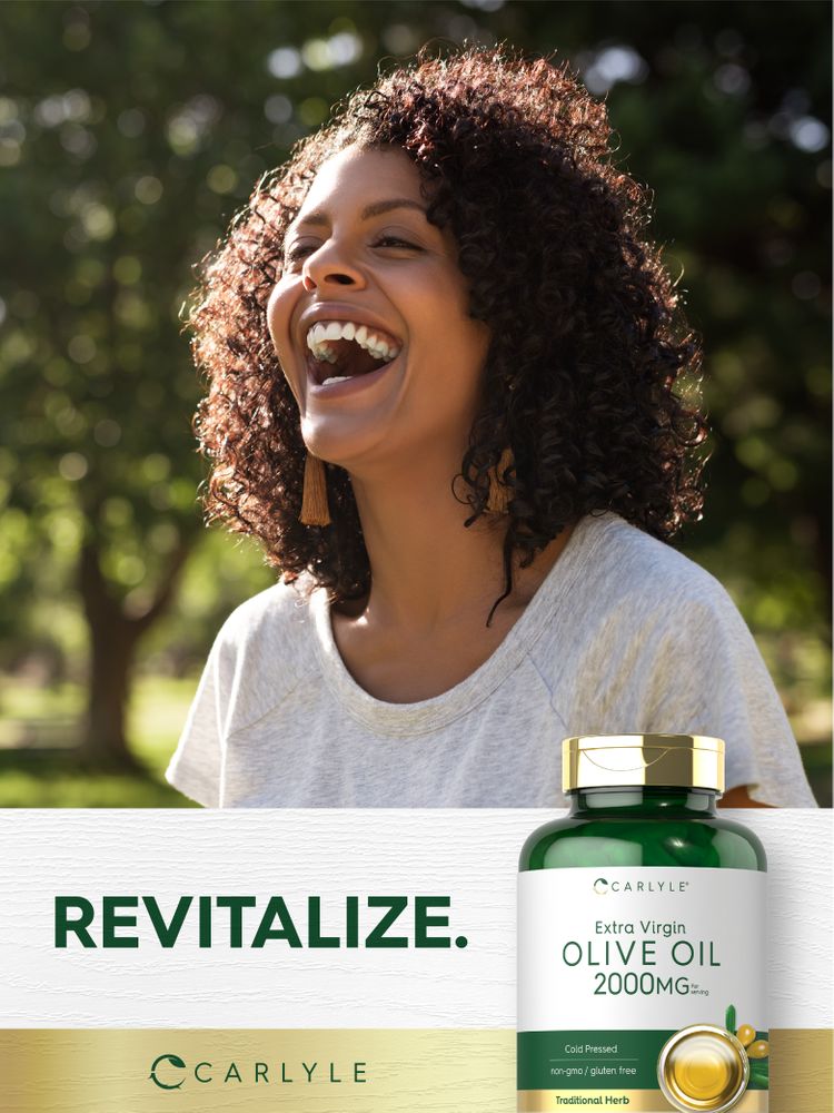 A young woman laughs outdoors holding a Carlyle Olive Oil bottle.