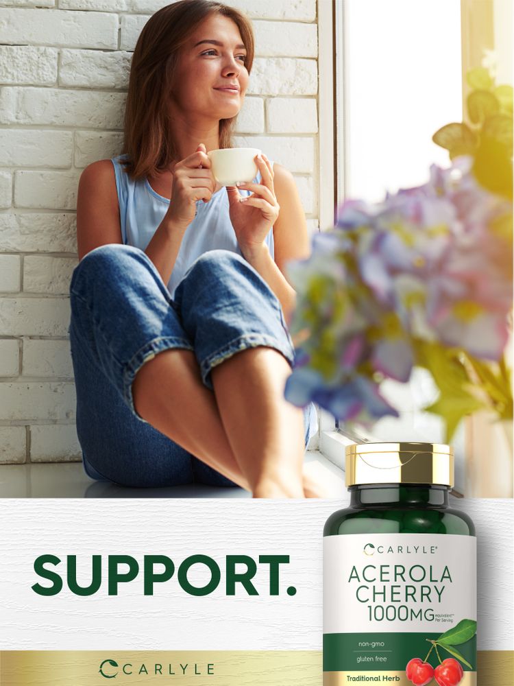 A hand holding a Carlyle Acerola Cherry 1000MG supplement bottle against a neutral background, showcasing the product size and design.