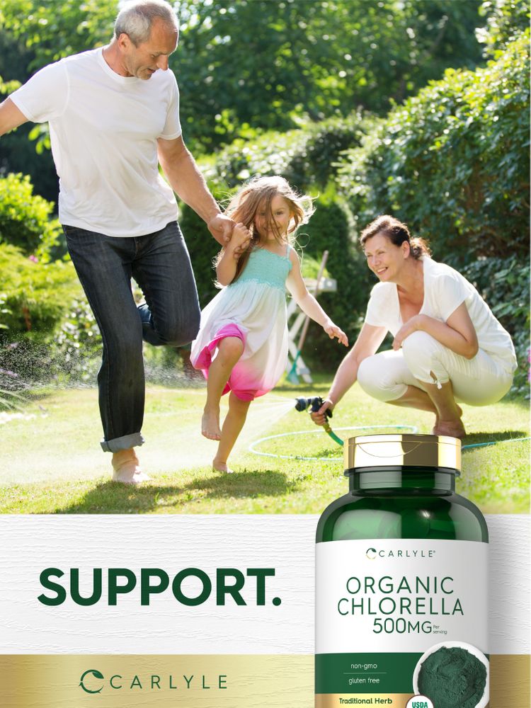 Man, woman, and young girl playing and watering plants in a sunny garden, with an Organic Chlorella bottle.