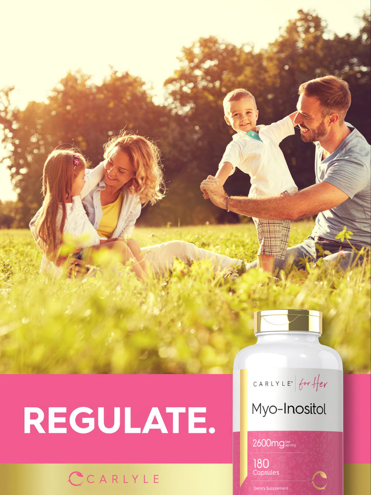 A family with two young children plays in a sunny field beside a Carlyle Myo-Inositol bottle.