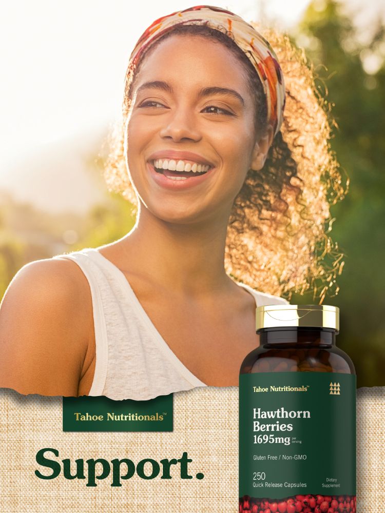 A young woman smiling outdoors next to a bottle of Tahoe Nutritionals Hawthorn Berries.