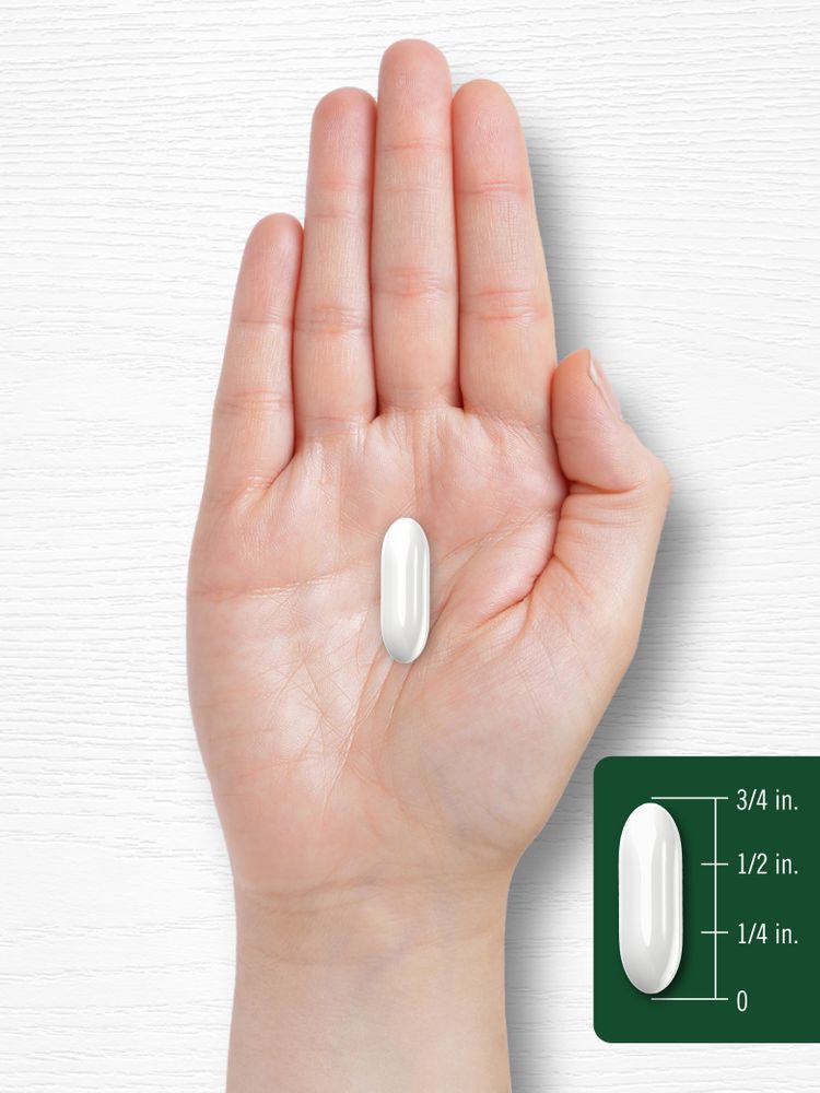 A softgel is shown with a hand for scale, measuring approximately three-fourths of an inch.