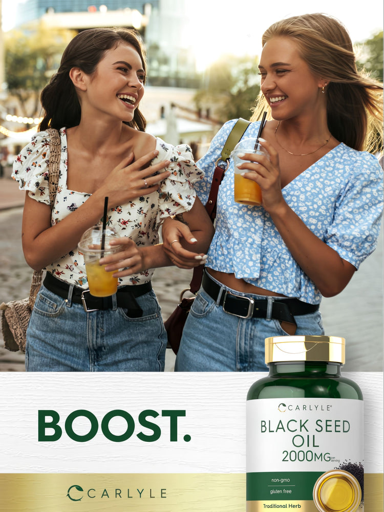Carlyle Black Seed Oil 2000 mg bottle with 'BOOST.' text, featuring two laughing young women in the background.