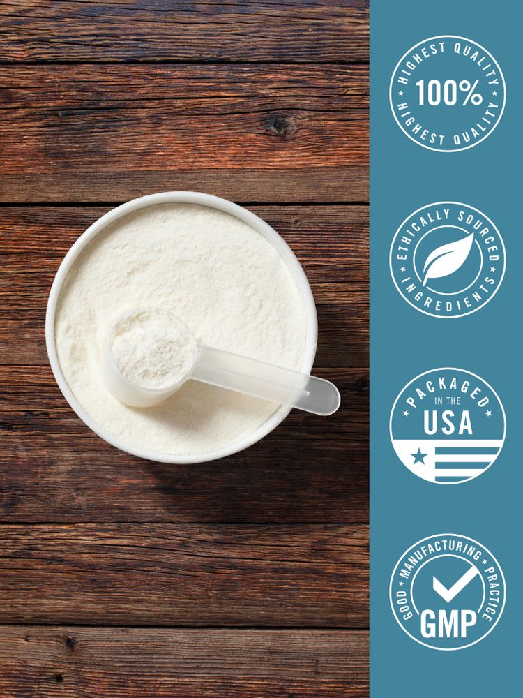 Colostrum & Collagen powder in a white bowl with a scoop on a wooden surface, showing texture and serving size.