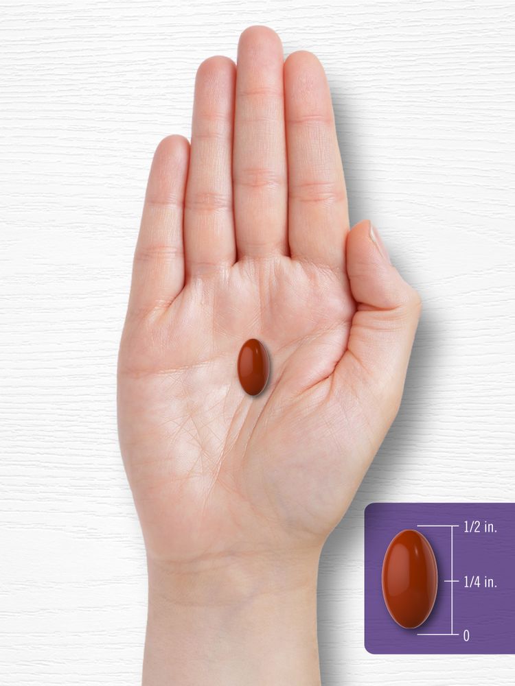 A brown softgel measuring half an inch long and a quarter inch wide on a bulk scale.