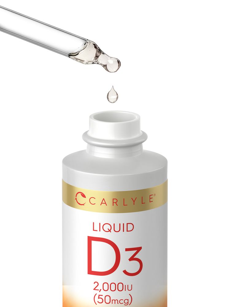 Carlyle Liquid D3 2,000 IU (50mcg) is being dispensed with a dropper back into its bottle.