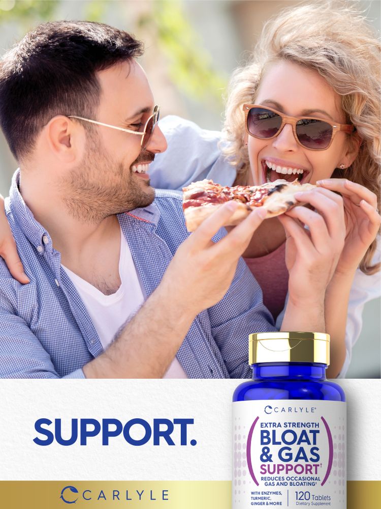 A young man and woman laugh and share pizza, with a Carlyle Bloat & Gas Support bottle nearby.