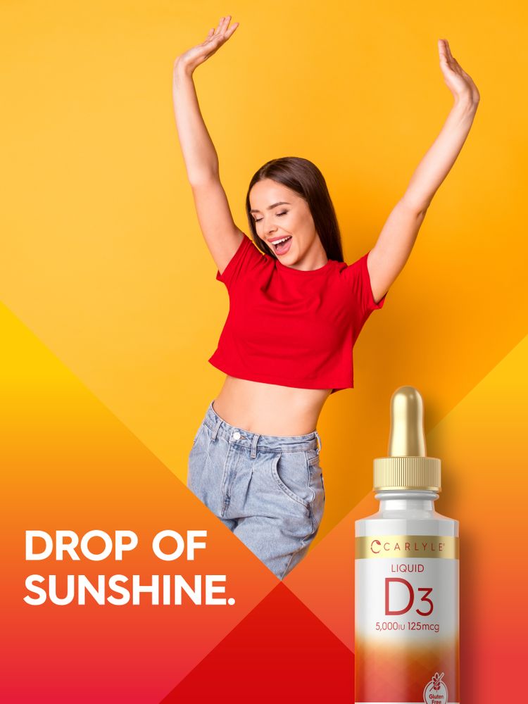A joyful young woman poses with raised arms next to a Carlyle Liquid D3 5,000 IU 125mcg bottle. Text: DROP OF SUNSHINE.