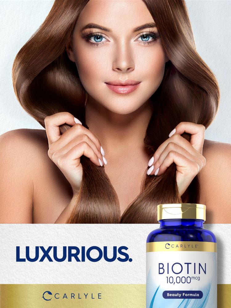 A young woman holds her long, brown hair beside a Carlyle Biotin 10,000 mcg bottle.