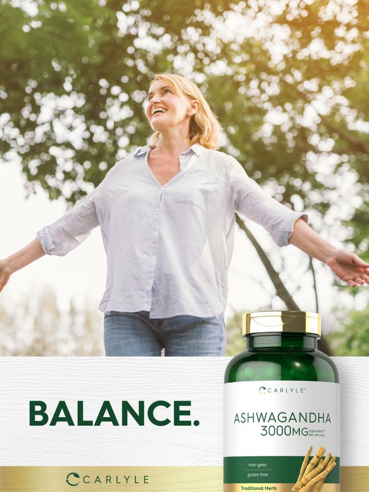 Blonde woman smiling with outstretched arms in nature beside a bottle of Carlyle Ashwagandha.