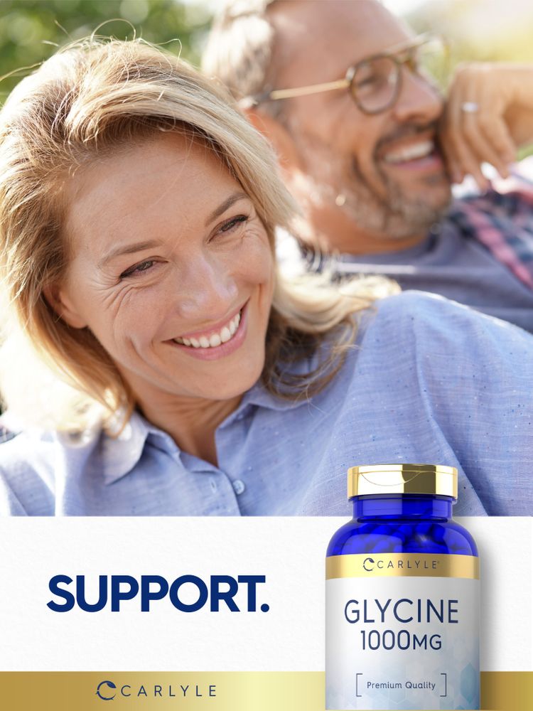 Middle-aged couple smiles with a bottle of Carlyle Glycine.